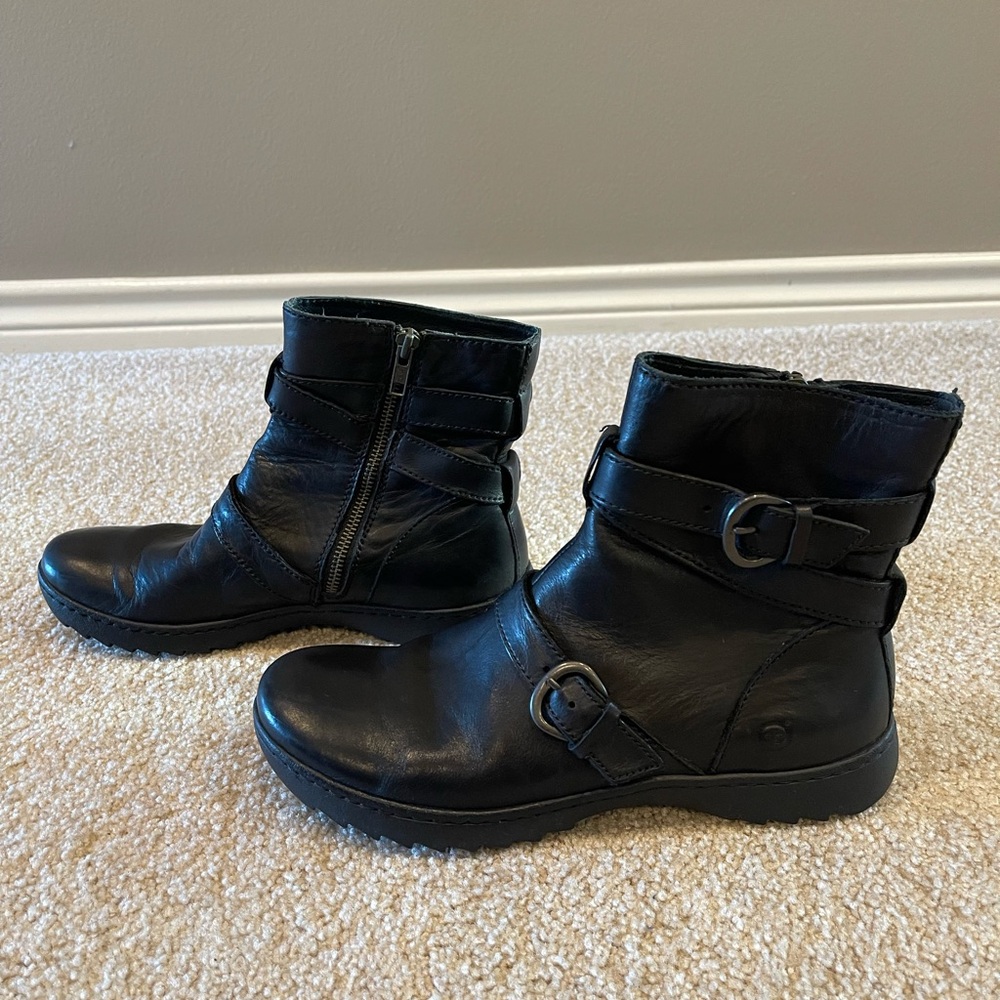 Born Black Leather Ankle Boots with stylish buckle accents and side zippers.